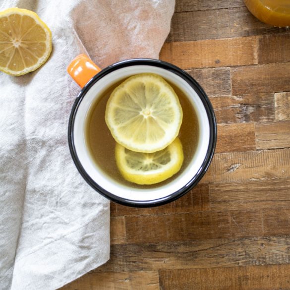 hot_toddy_2 a ginger turmeric honey hot toddy in a big mug on a wood coffee table