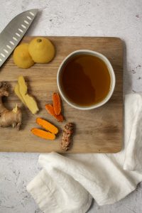 ginger turmeric honey syrup with chopped pieces