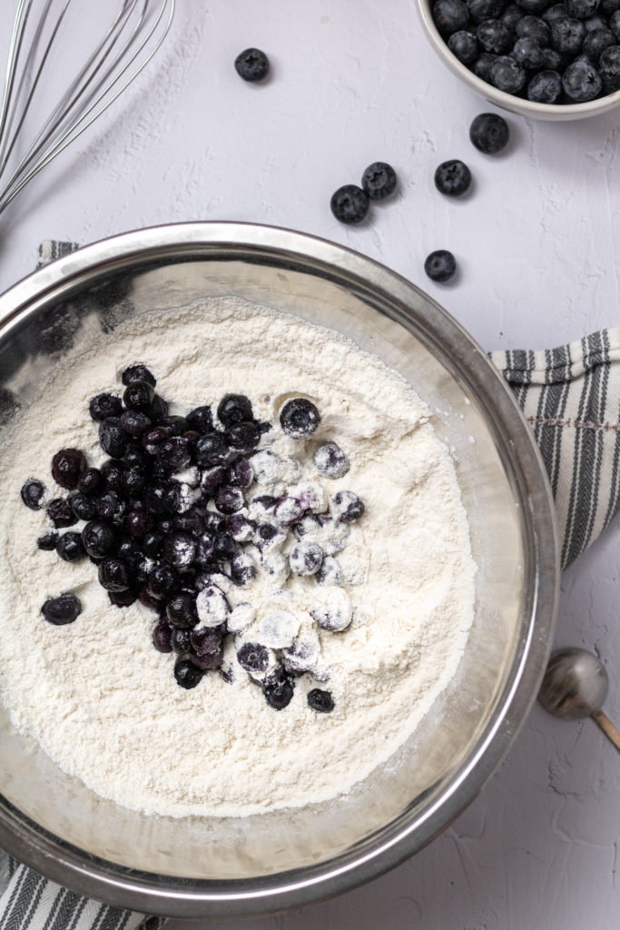 blueberries being coated in flour