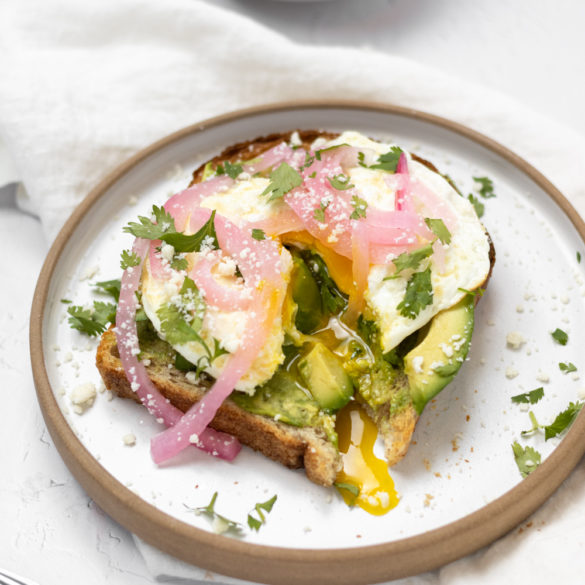 cali_avo_002 Calif Avocado Toast sliced so that the over easy egg yolk is running down the toast